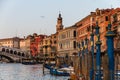 VENICE, Italy - April 25, 2013: Scenic View of Gran Canal with Rialto Bridge at Sunset. Beautiful Panorama with warm Colors Royalty Free Stock Photo