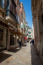 Tourists and locals walking around the beautiful streets of Venice in a sunny early spring day Royalty Free Stock Photo