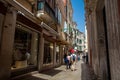 Tourists and locals walking around the beautiful streets of Venice in a sunny early spring day Royalty Free Stock Photo