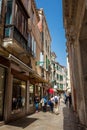 Tourists and locals walking around the beautiful streets of Venice in a sunny early spring day Royalty Free Stock Photo