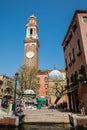 Tourists and locals walking around the beautiful streets of Venice in a sunny early spring day Royalty Free Stock Photo