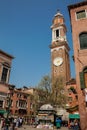 Tourists and locals walking around the beautiful streets of Venice in a sunny early spring day Royalty Free Stock Photo