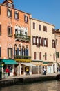 Tourists and locals walking around the beautiful streets of Venice in a sunny early spring day Royalty Free Stock Photo