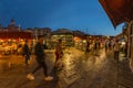 VENICE, ITALY - August 02, 2019: The busy night streets of Venice. People walk, relax, sit in numerous cafes. Night shot long