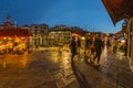 VENICE, ITALY - August 02, 2019: The busy night streets of Venice. People walk, relax, sit in numerous cafes. Night shot long