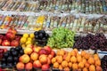 Fruits apples, peaches, grapes, apricots and plums and spices on table counter Royalty Free Stock Photo