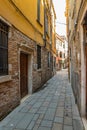 VENICE, ITALY - August 02, 2019: Narrow pedestrian streets of Venice bitween the channels. Some quiet places almost without people Royalty Free Stock Photo