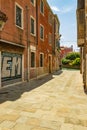 VENICE, ITALY - August 02, 2019: Narrow pedestrian streets of Venice bitween the channels. Some quiet places almost without people