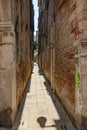 VENICE, ITALY - August 02, 2019: Narrow pedestrian streets of Venice bitween the channels. Some quiet places almost without people