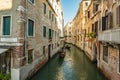 VENICE, ITALY - August 03, 2019: Narrow pedestrian streets of Venice bitween the channels. Some quiet places almost without people Royalty Free Stock Photo
