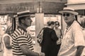 Venice.Italy. Residents of Venice. Golderriers in hats, toned- sepia Royalty Free Stock Photo