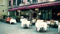 VENICE, ITALY - AUGUST 8, 2017. Tables at La Fenice restaurant facade Royalty Free Stock Photo