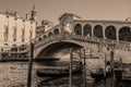 Venice.Italy.Tourists in gondolas sailing on the grand canal, toned- sepia Royalty Free Stock Photo