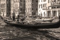 Venice.Italy.Tourists in gondolas sailing on the grand canal, toned- sepia Royalty Free Stock Photo