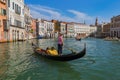 VENICE, ITALY - AUGUST 21, 2016: Tourists ride in gondola in Grand Canal on August 21, 2016 in Venice Italy