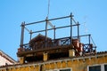 Typical altana wooden balcony on Venice roof in a sunny summer day in Italy Royalty Free Stock Photo