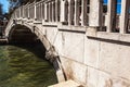 VENICE, ITALY - AUGUST 21, 2016: View on the cityscape and lovely bridge on the canal of Venice on August 21, 2016 in Venice Royalty Free Stock Photo