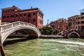 VENICE, ITALY - AUGUST 21, 2016: View on the cityscape and lovely bridge on the canal of Venice on August 21, 2016 in Venice Royalty Free Stock Photo