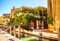 VENICE, ITALY - AUGUST 21, 2016: View on the cityscape and lovely bridge on the canal of Venice on August 21, 2016 in Venice Royalty Free Stock Photo