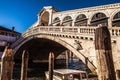 VENICE, ITALY - AUGUST 20, 2016: View on the cityscape and lovely bridge on the canal of Venice on August 20, 2016 in Venice Royalty Free Stock Photo