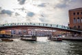 VENICE, ITALY - AUGUST 17, 2016: View on the cityscape and lovely bridge on the canal of Venice on August 17, 2016 in Venice, Ital Royalty Free Stock Photo