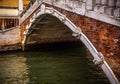 VENICE, ITALY - AUGUST 17, 2016: View on the cityscape and lovely bridge on the canal of Venice on August 17, 2016 in Venice, Ital Royalty Free Stock Photo