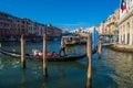VENICE, ITALY - August 28, 2021: View of the gondola taking tourists along the grand canal of Venice with typical houses in the Royalty Free Stock Photo