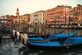 Venice Grand Canal with gondolas near Rialto bridge at dusk, popular tourist destination Royalty Free Stock Photo