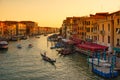 Venice cityscape at sunset, Grand Canal with colorful houses and boats, Italy