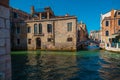 VENICE, ITALY - August 27, 2021:  View of people crossing the bridge over the beautiful canals of Venice Royalty Free Stock Photo