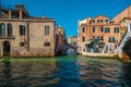 VENICE, ITALY - August 27, 2021:  View of people crossing the bridge over the beautiful canals of Venice Royalty Free Stock Photo