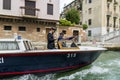 Water gendarmerie on a boat patrols canals of the city of Venice Royalty Free Stock Photo