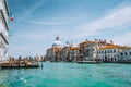 Venice, Italy. Beautiful view of turquoise-green colored Grand Canal and Basilica Santa Maria della Salute against blue Royalty Free Stock Photo