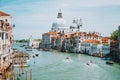 Venice, Italy. Daily boat and tourist hectic on Grand Canal and Basilica Santa Maria della Salute Royalty Free Stock Photo