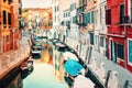 Venice, Italy. Small canal with boats and old historic buildings.