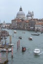 Venice, Italy and church Santa Maria della Salute with Grand canal and many boats Royalty Free Stock Photo