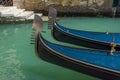 Venice, Italy. Close up of a two gondolas and the blue water of a Venetian canal, in a beautiful sunny day Royalty Free Stock Photo