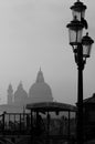Venice, Italy, December 28, 2018 Basilica in the background with typical Venetian street lamp in the foreground