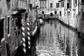 Venice, Italy, December 28, 2018 narrow passage through the calle of Venice with a gondola passing in the background