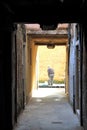 Venice, Italy, December 28, 2018 narrow passage through the calle of Venice with a gondola passing in the background