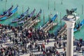 Venice, Italy elevated view of crowd during carnival at Gondola Ferry Pier in Saint Mark square, seen from San Royalty Free Stock Photo