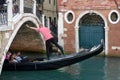 VENICE, ITALY/EUROPE - OCTOBER 12 : Gondolier plying his tradein Venice Italy on October 12, 2014. Unidentified people.