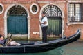 VENICE, ITALY/EUROPE - OCTOBER 12 : Gondolier plying his tradein Venice Italy on October 12, 2014. Unidentified people. Royalty Free Stock Photo