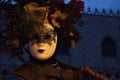 VENICE, ITALY - Feb 09, 2016: A Venetian masked masquerade in costume at the carnival of Venice