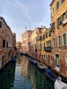 Venice, Italy - February 2019: Beautiful view of a venice canal with water reflection Royalty Free Stock Photo