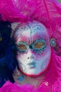 Close-up of typical pink Venetian carnival masks at a street shop in Venice, Italy.