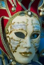 Close-up of typical Venetian carnival masks with musical motifs at a street shop in Venice, Italy.