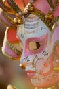 Close-up of typical Venetian carnival masks with musical motifs at a street shop in Venice, Italy.