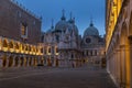 Courtyard of the Doge\'s Palace (Palazzo Ducale) in Venice. San Marco basilica in background Royalty Free Stock Photo