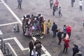 Venice Italy elevated day view of street vendor selling hats and carnival masks, with tourists on Saint Mark Royalty Free Stock Photo